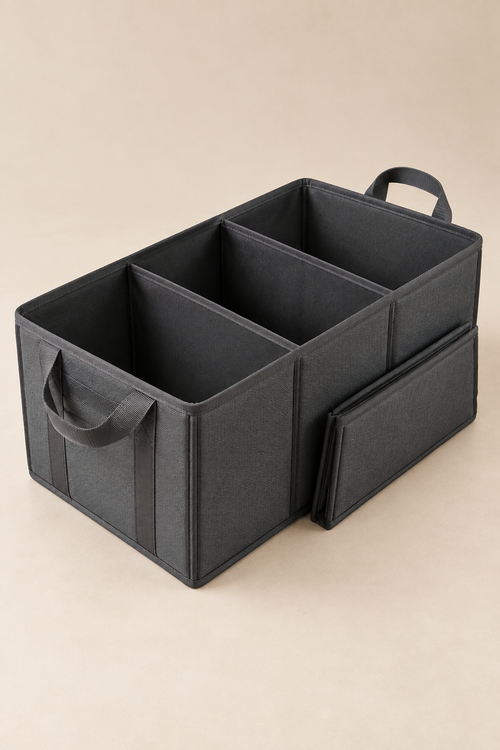 A charcoal fold-flat trunk organizer shown open with divided storage compartments.