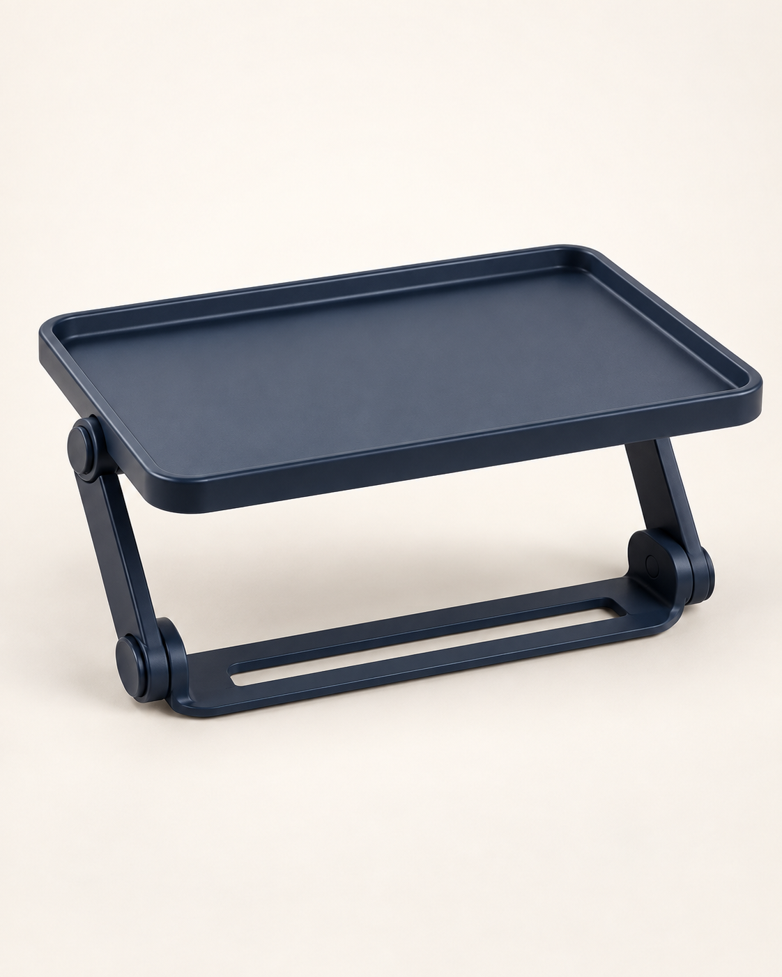 A foldable raised-edge tray for compatible rear-seat, parked-use setups.